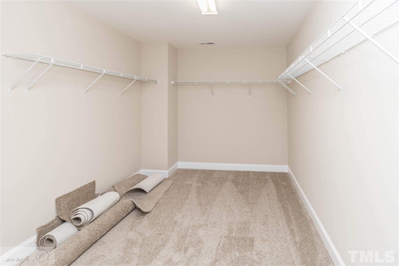 3508 Bloomfield Way Raleigh, NC 27616 - Photo 16 of 24 a view of walk in closet with empty racks