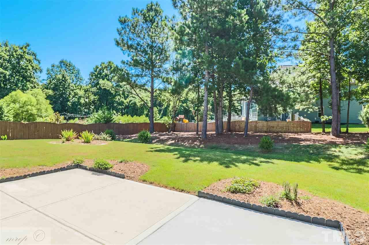 3508 Bloomfield Way Raleigh, NC 27616 - Photo 22 of 24 a view of backyard with swimming pool and green space