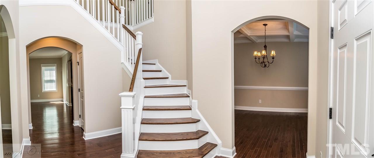3508 Bloomfield Way Raleigh, NC 27616 - Photo 4 of 24 a view of staircase with white walls and entryway