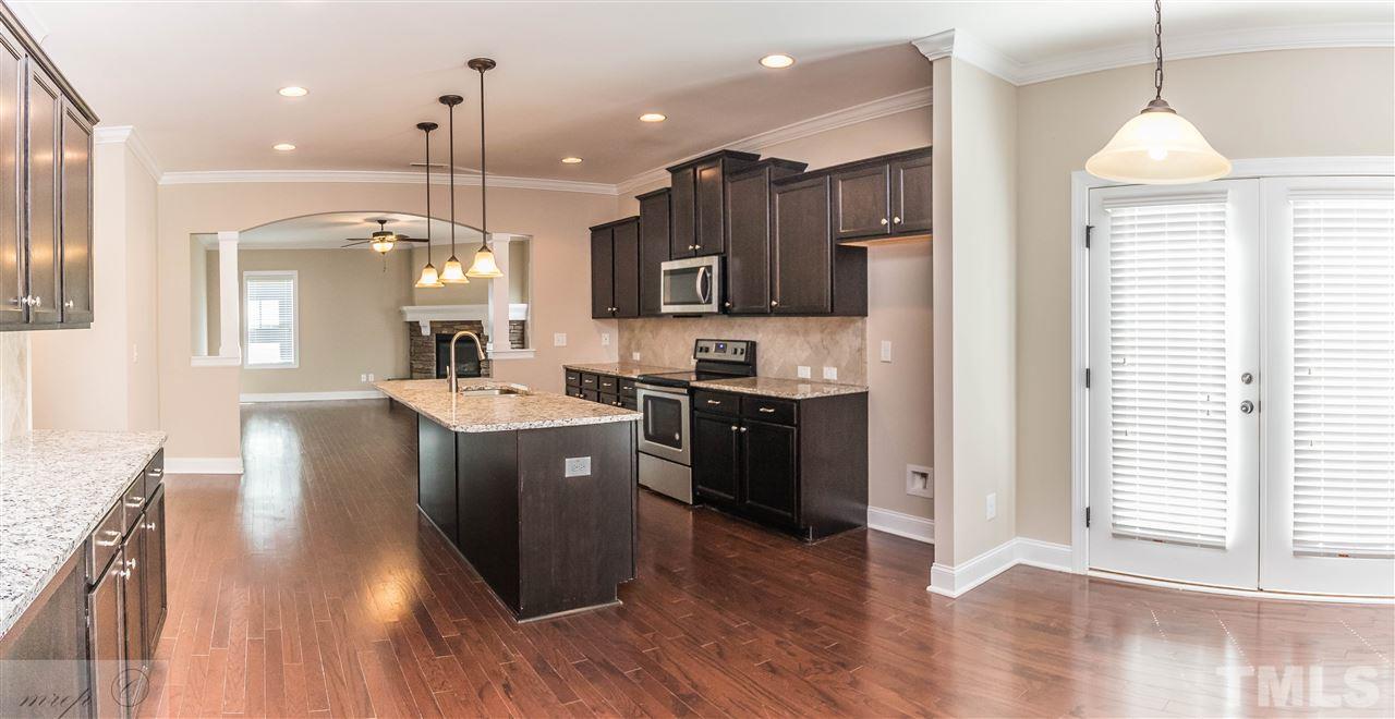3508 Bloomfield Way Raleigh, NC 27616 - Photo 5 of 24 a kitchen with a sink and cabinets
