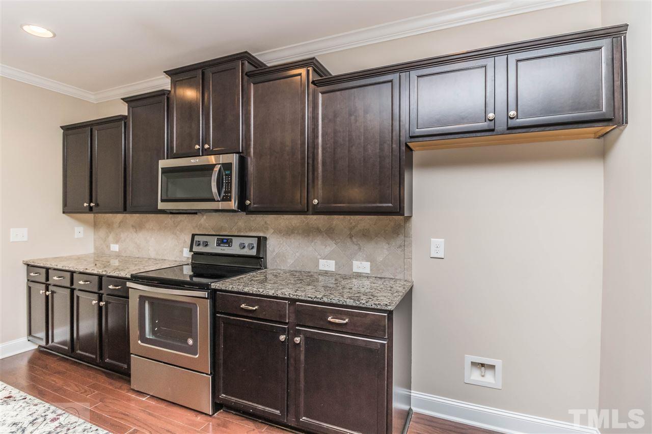 3508 Bloomfield Way Raleigh, NC 27616 - Photo 8 of 24 a kitchen with granite countertop cabinets stainless steel appliances and a counter space