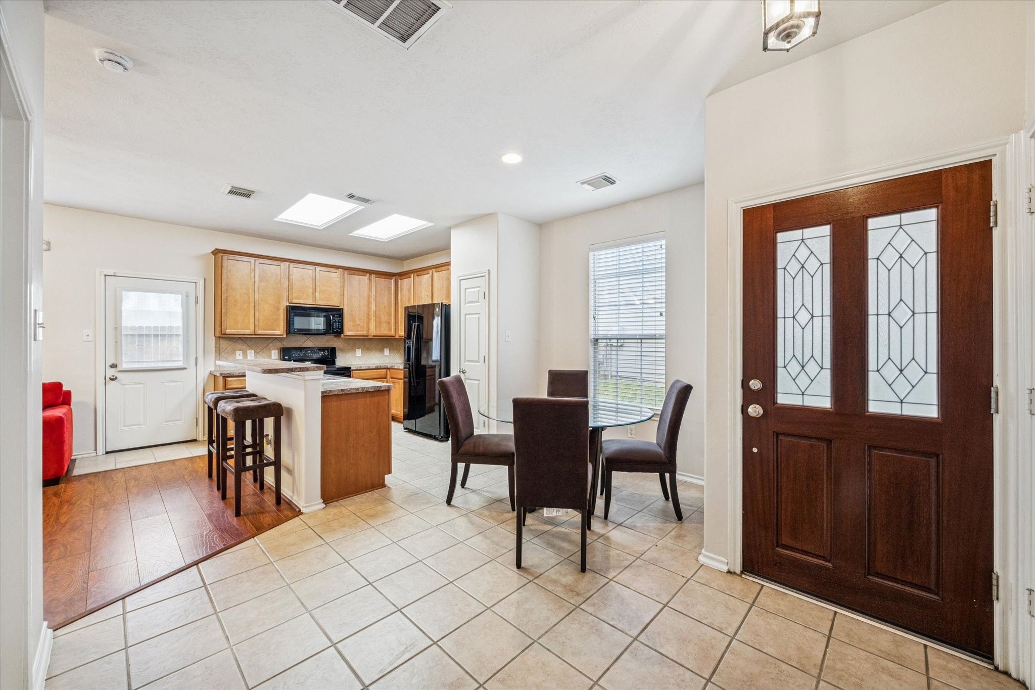 3206 Pearl Bluff Lane Houston, TX 77047 - Photo 4 of 20 a view of a dining room with furniture window and wooden floor