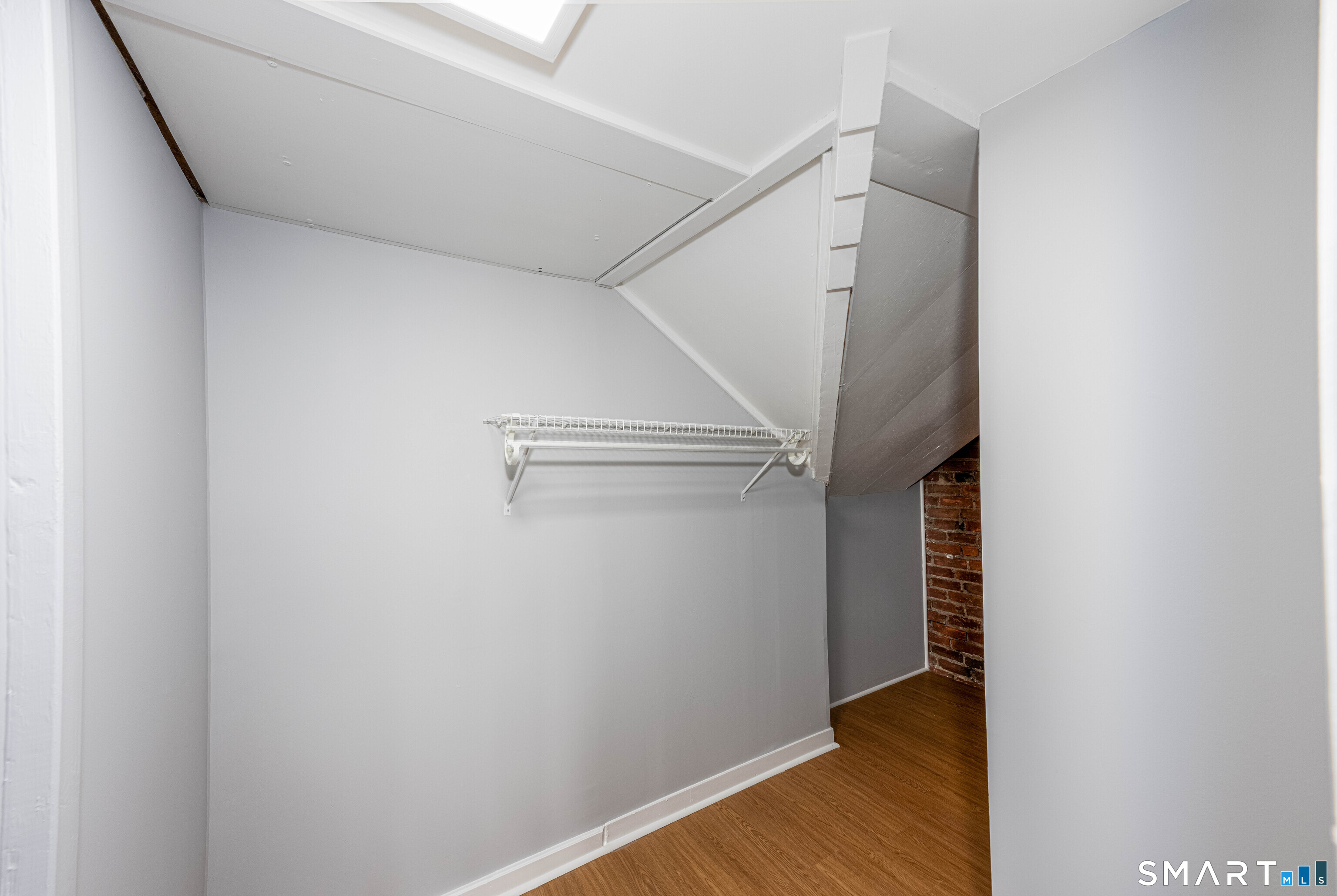 148 Everit Street, Unit F New Haven, CT 06511 - Photo 18 of 26 a view of walk in closet with wooden floor