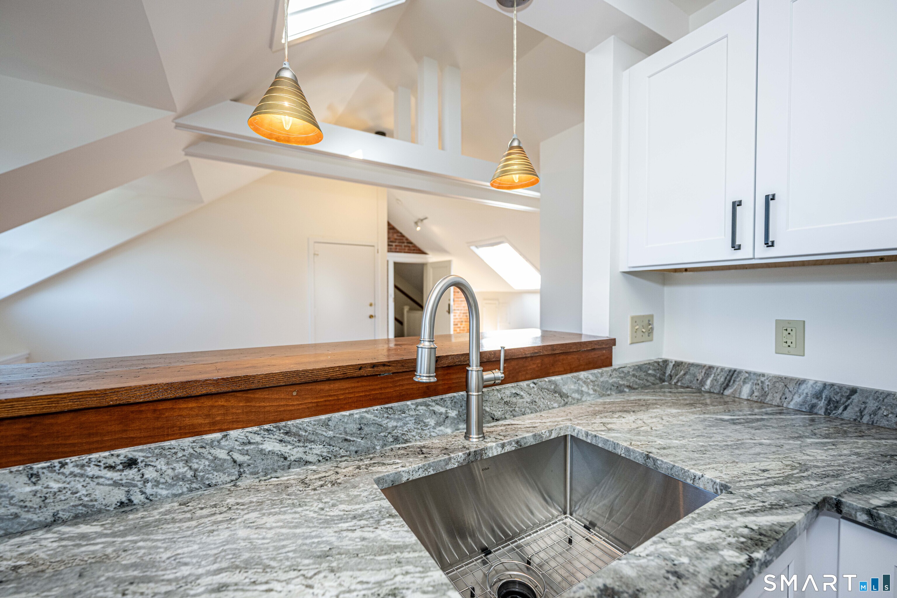 148 Everit Street, Unit F New Haven, CT 06511 - Photo 9 of 26 a kitchen with granite countertop a sink and a stove