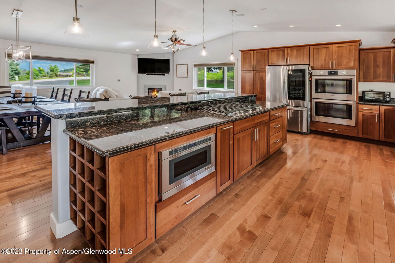 a kitchen with stainless steel appliances granite countertop a stove and a sink