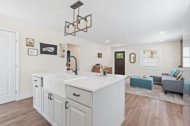 a view of living room with furniture and wooden floor