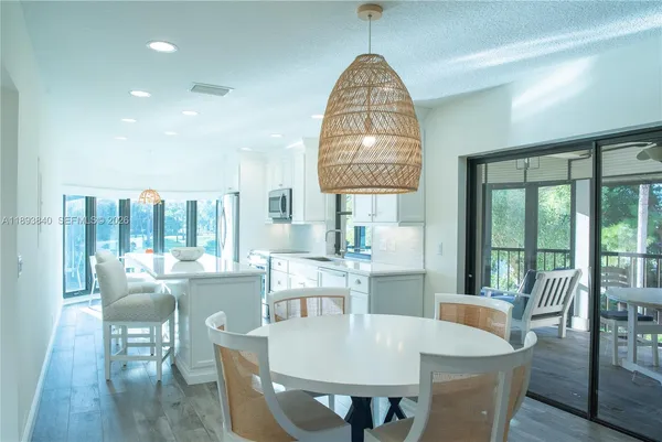 a view of a dining room with furniture window and outside view