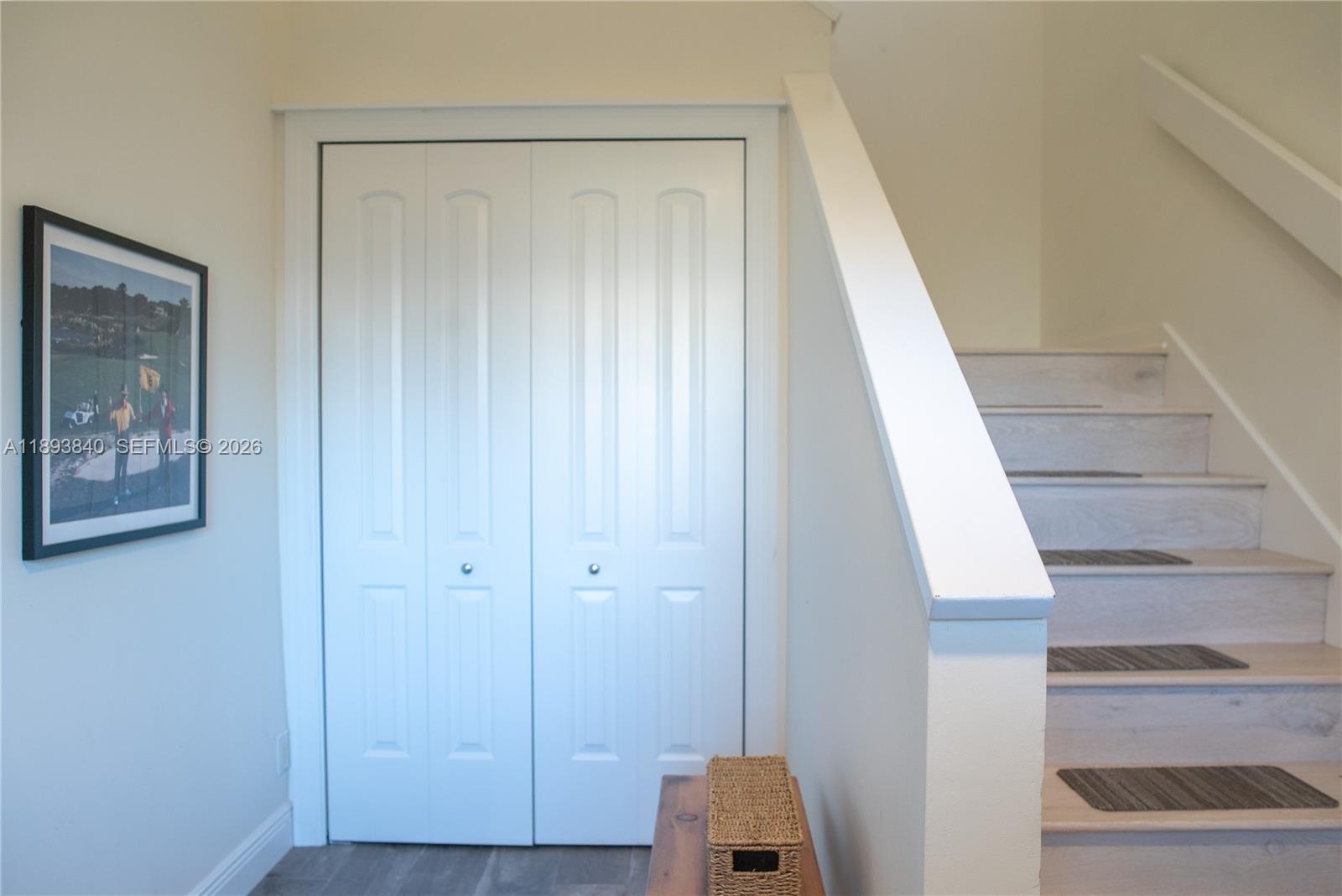 17081 Waterbend Drive, Unit 227 Jupiter, FL 33477 - Photo 14 of 38 an entryway with wooden floor and cabinet