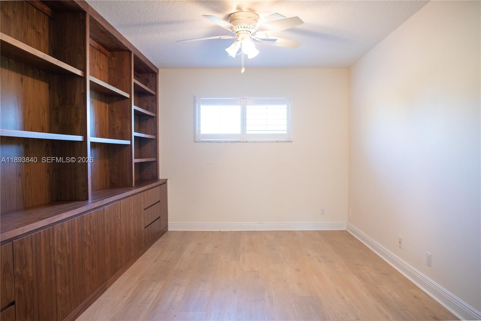 17081 Waterbend Drive, Unit 227 Jupiter, FL 33477 - Photo 16 of 38 wooden floor in an empty room with a window
