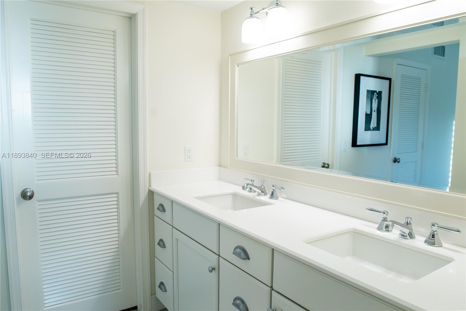 17081 Waterbend Drive, Unit 227 Jupiter, FL 33477 - Photo 21 of 38 a bathroom with a sink and a mirror
