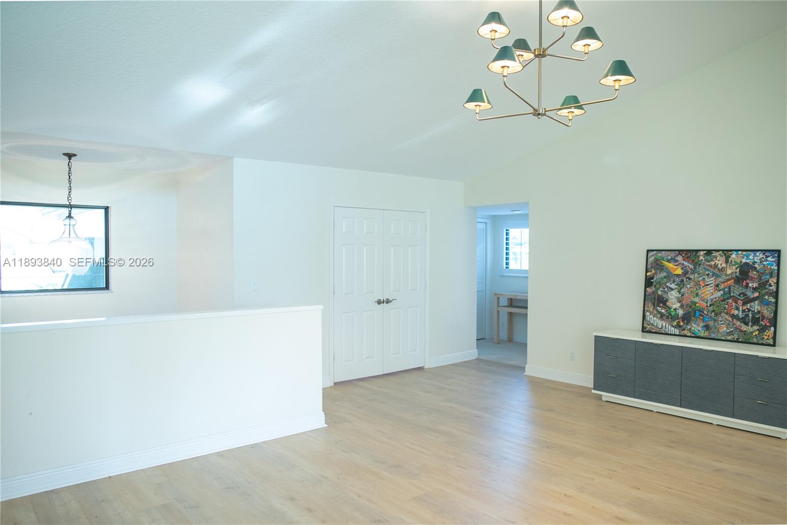 17081 Waterbend Drive, Unit 227 Jupiter, FL 33477 - Photo 25 of 38 a view of an empty room with wooden floor