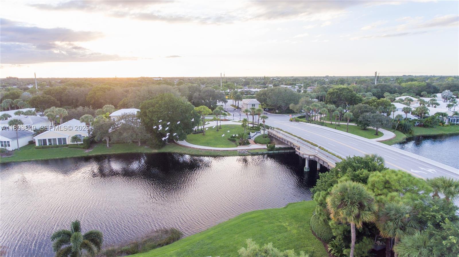 17081 Waterbend Drive, Unit 227 Jupiter, FL 33477 - Photo 31 of 38 an aerial view of a house with a garden and lake view