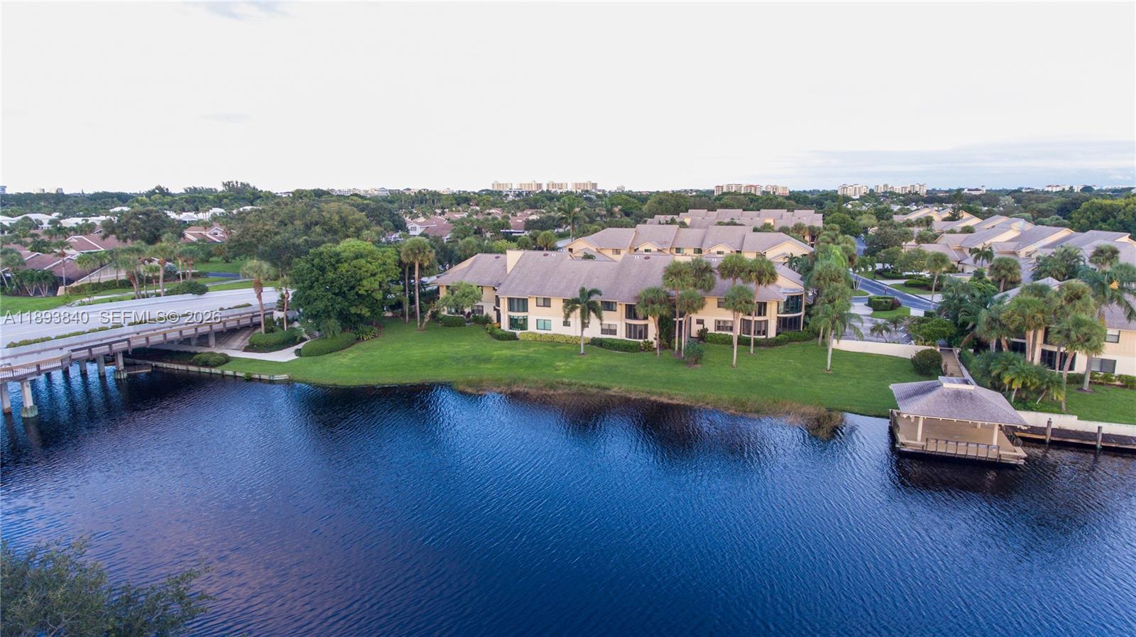 17081 Waterbend Drive, Unit 227 Jupiter, FL 33477 - Photo 38 of 38 an aerial view of a house with swimming pool and big yard