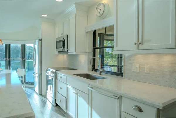 a kitchen with a stove and a microwave