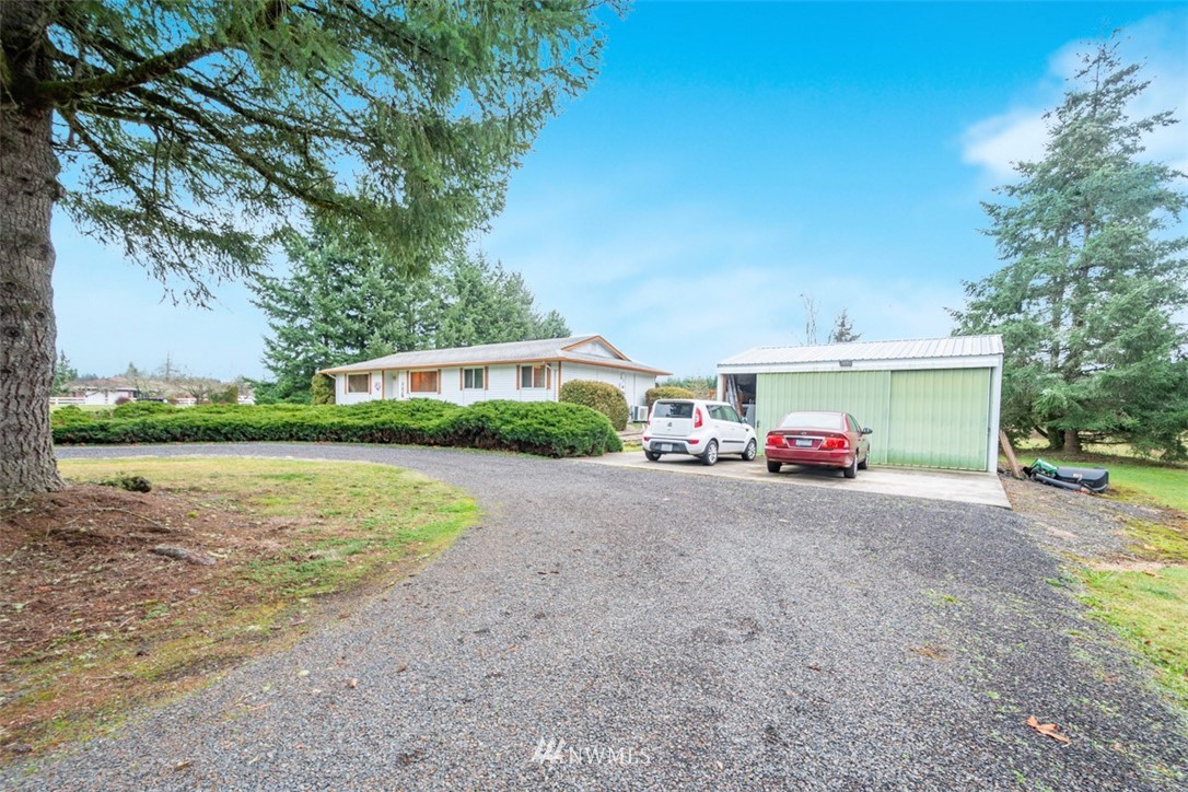 209 Vista Road Chehalis, WA 98532 - Photo 21 of 22 a view of a house with a yard and a garage