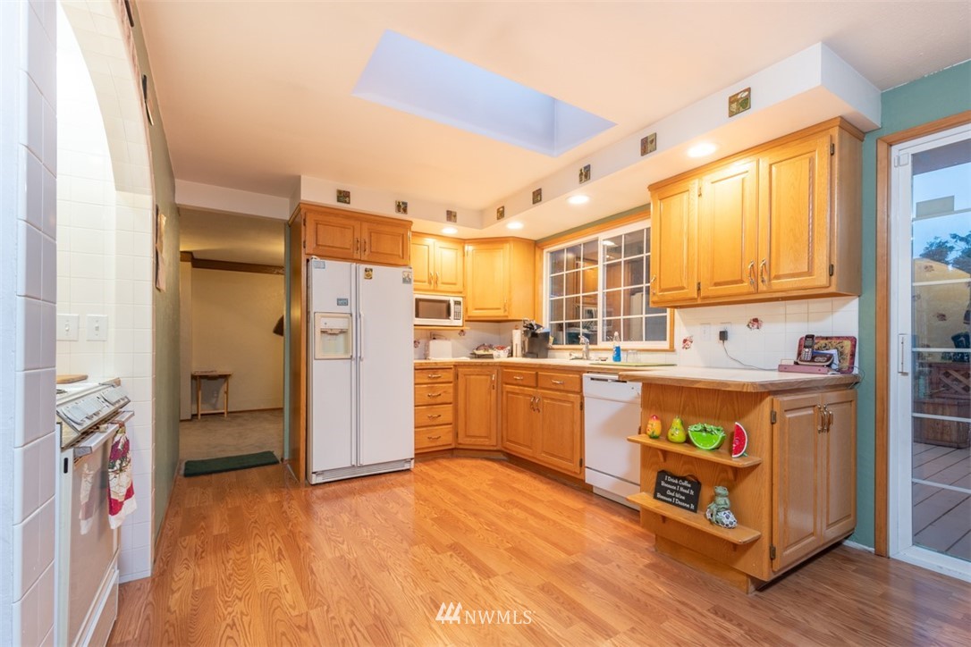 209 Vista Road Chehalis, WA 98532 - Photo 5 of 22 a large kitchen with stainless steel appliances granite countertop a refrigerator and a stove top oven