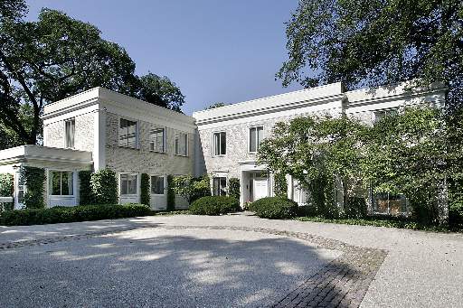 Undisclosed Address Lake Forest, IL 60045 - Photo 1 of 1 a front view of a house with a yard and garage