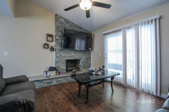 900 North Sierra View Street Ridgecrest, CA 93555 - Photo 18 of 42 a living room with furniture and a fireplace