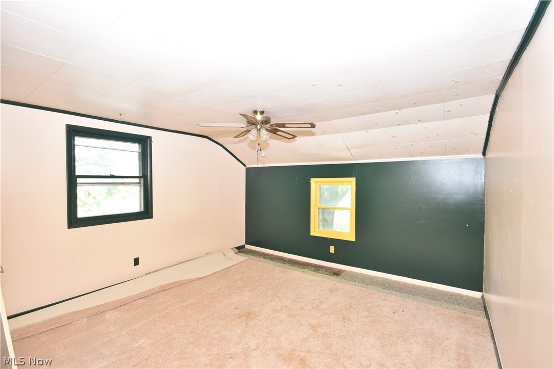 5694 Middle Ridge Road Madison, OH 44057 - Photo 16 of 27 Carpeted empty room featuring ceiling fan