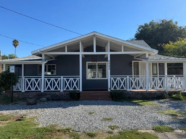 a view of front a house with a yard