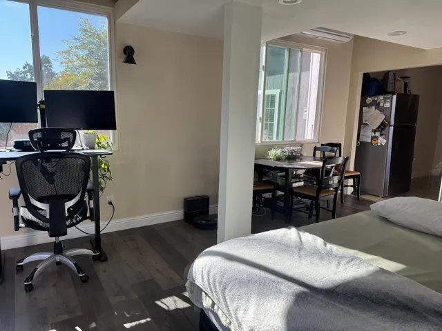 a bedroom with a bed and a table