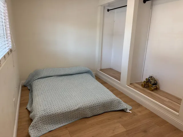 a room with a bed and a window