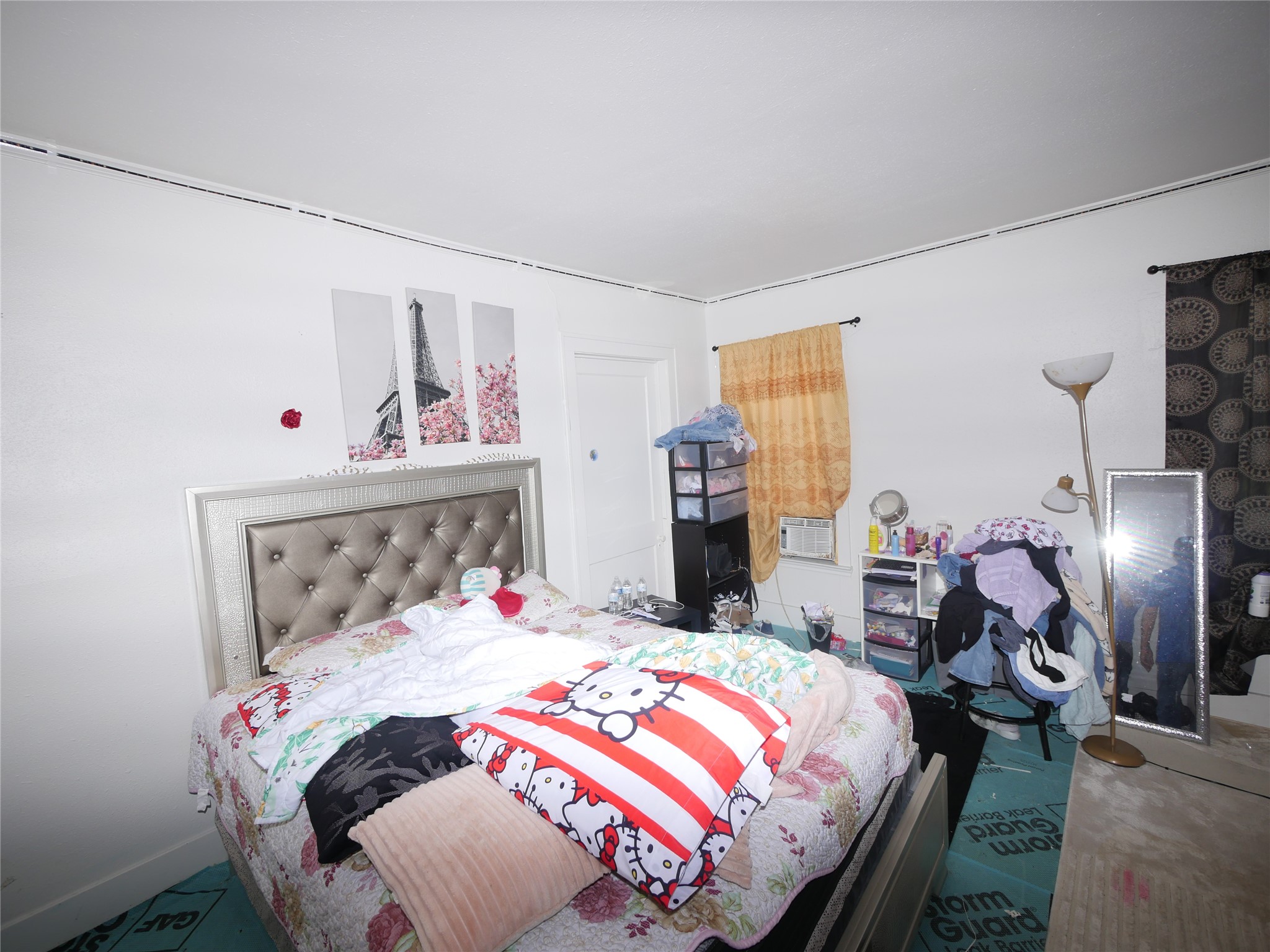 1609 Hussion Street Houston, TX 77003 - Photo 4 of 6 a bedroom with a bed and wooden floor