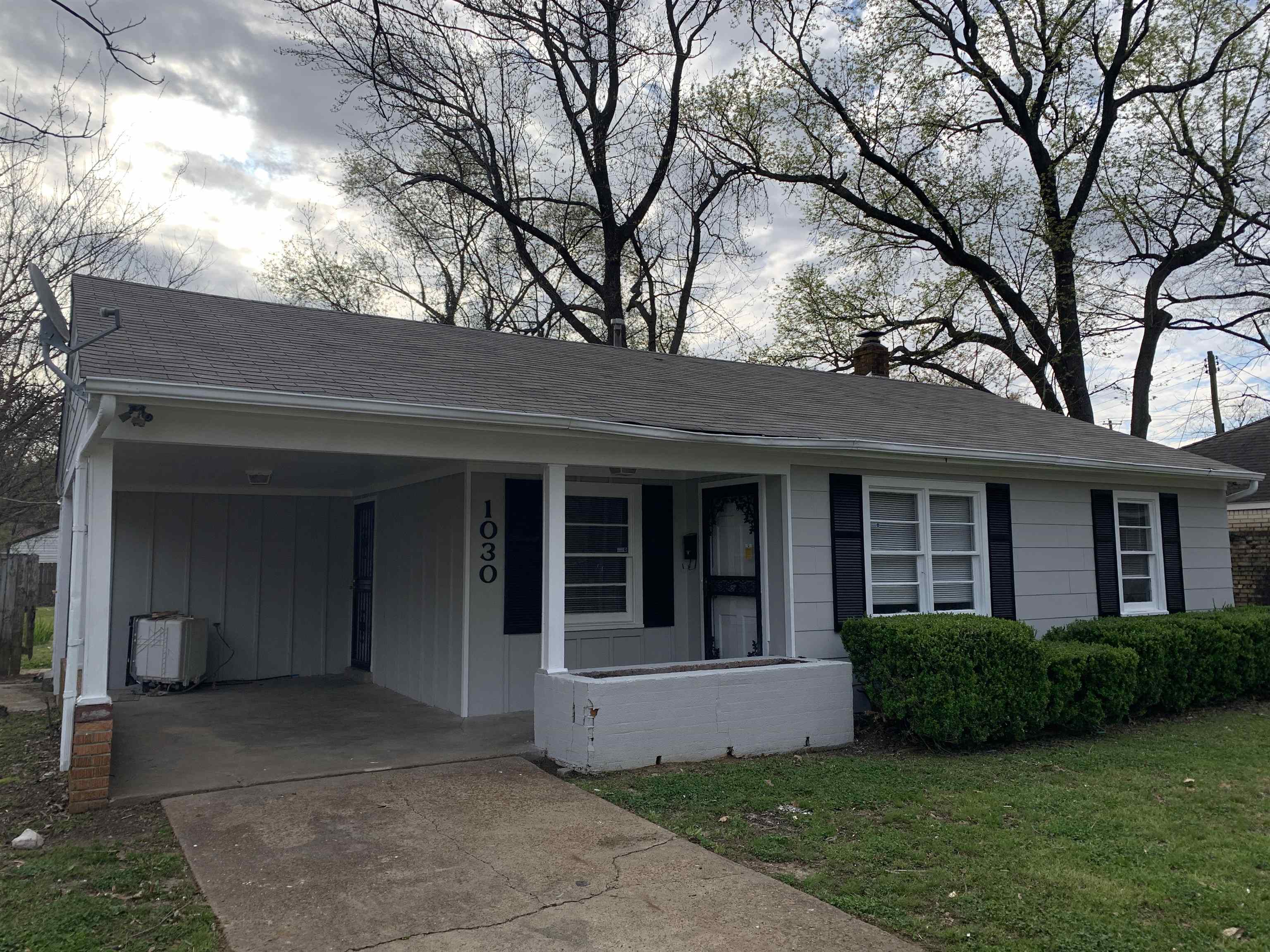 1030 Avon Road Memphis, TN 38122 - Photo 1 of 8 a view of a brick house with a large windows and a large tree