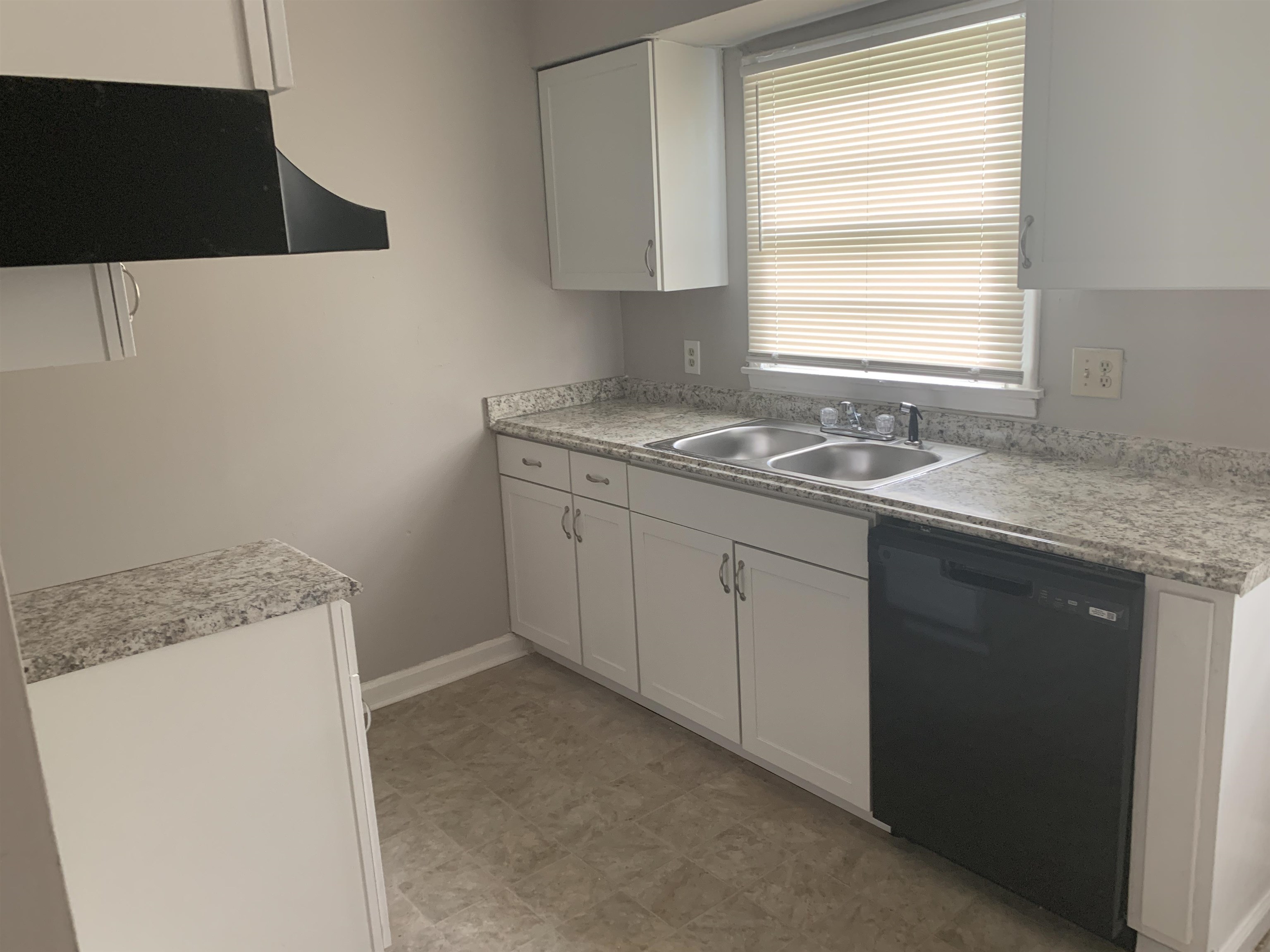 1030 Avon Road Memphis, TN 38122 - Photo 3 of 8 a utility room with a sink a vanity and a window