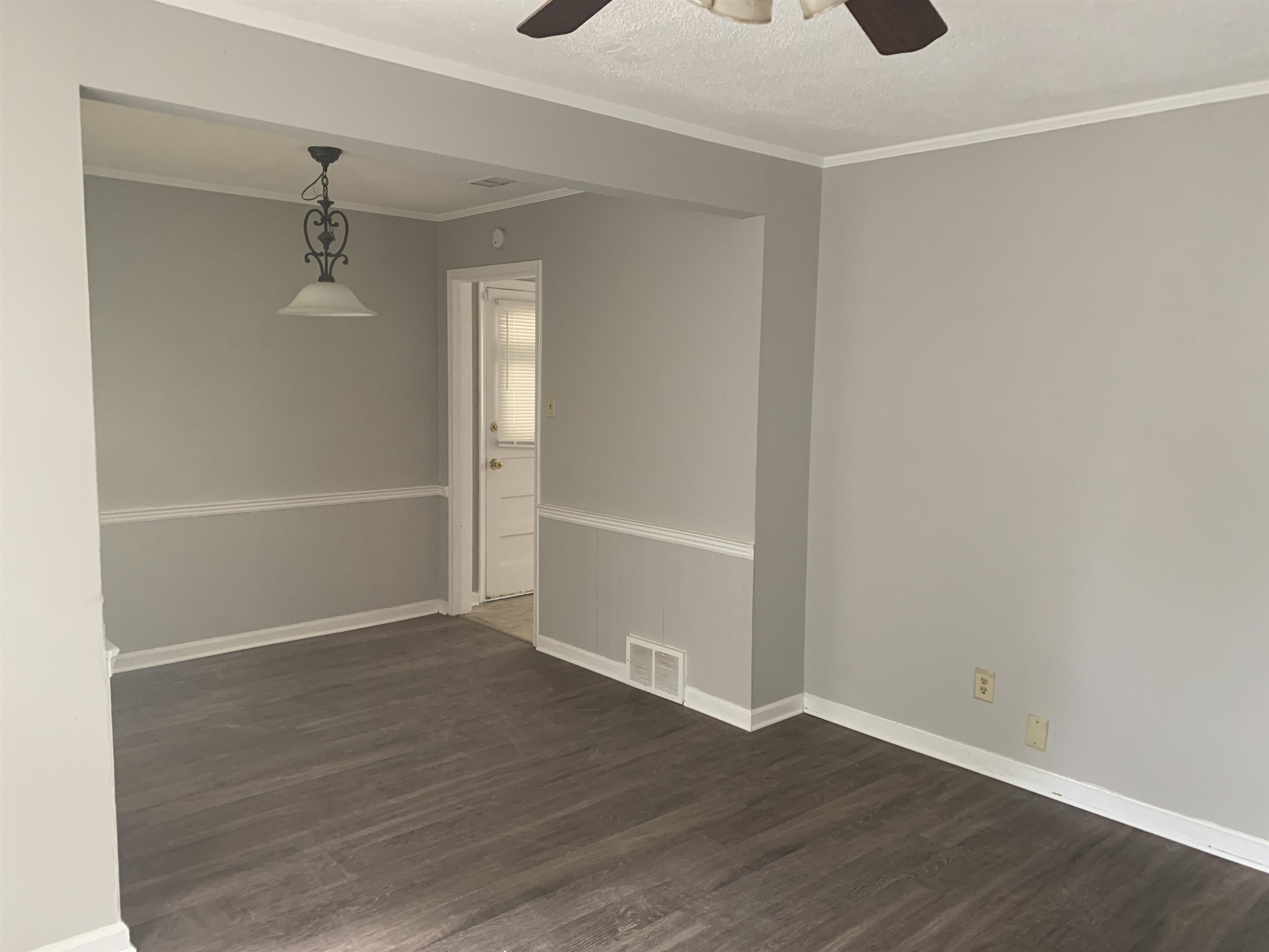 1030 Avon Road Memphis, TN 38122 - Photo 5 of 8 a view of an empty room with wooden floor