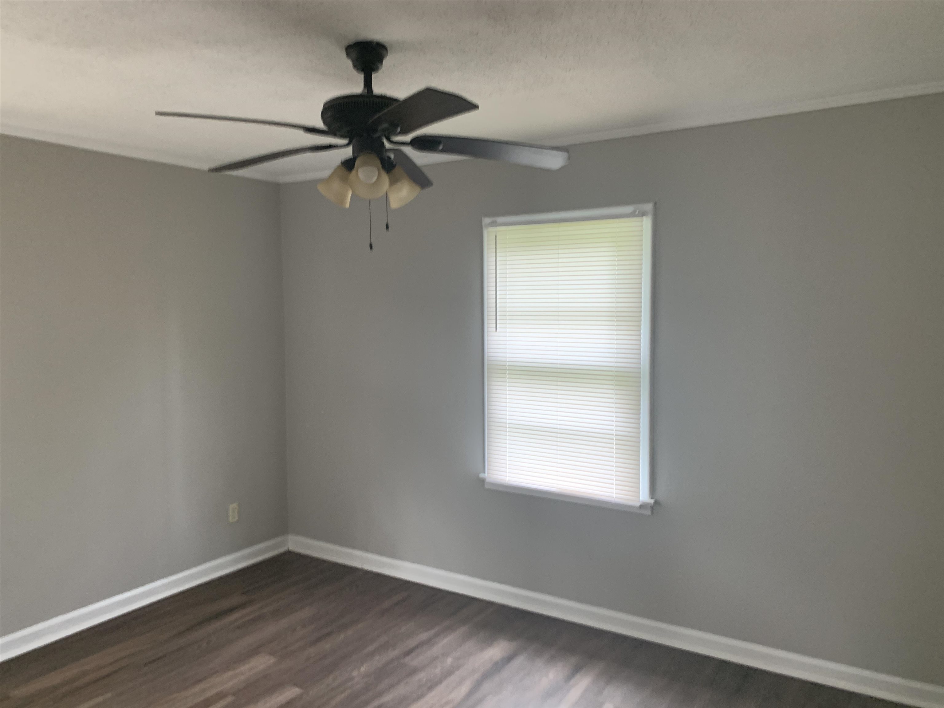 1030 Avon Road Memphis, TN 38122 - Photo 7 of 8 a view of a small space with wooden floor and a window