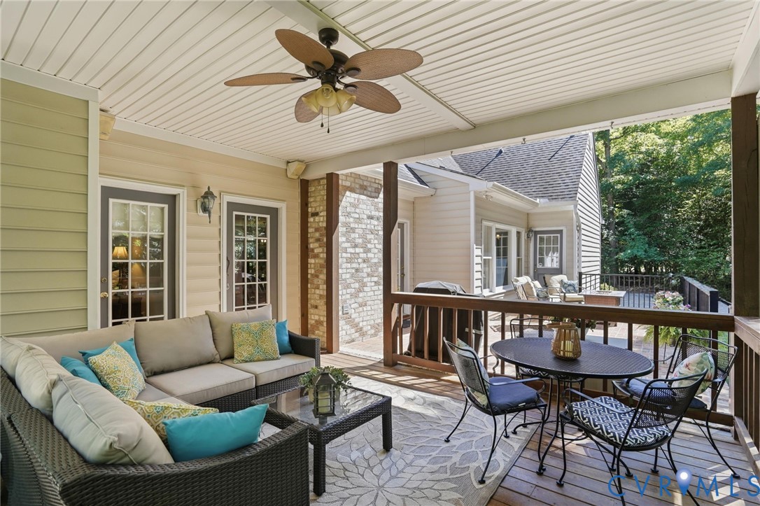 12123 Deer Ridge Court Ashland, VA 23005 - Photo 59 of 63 a balcony with furniture and a large window