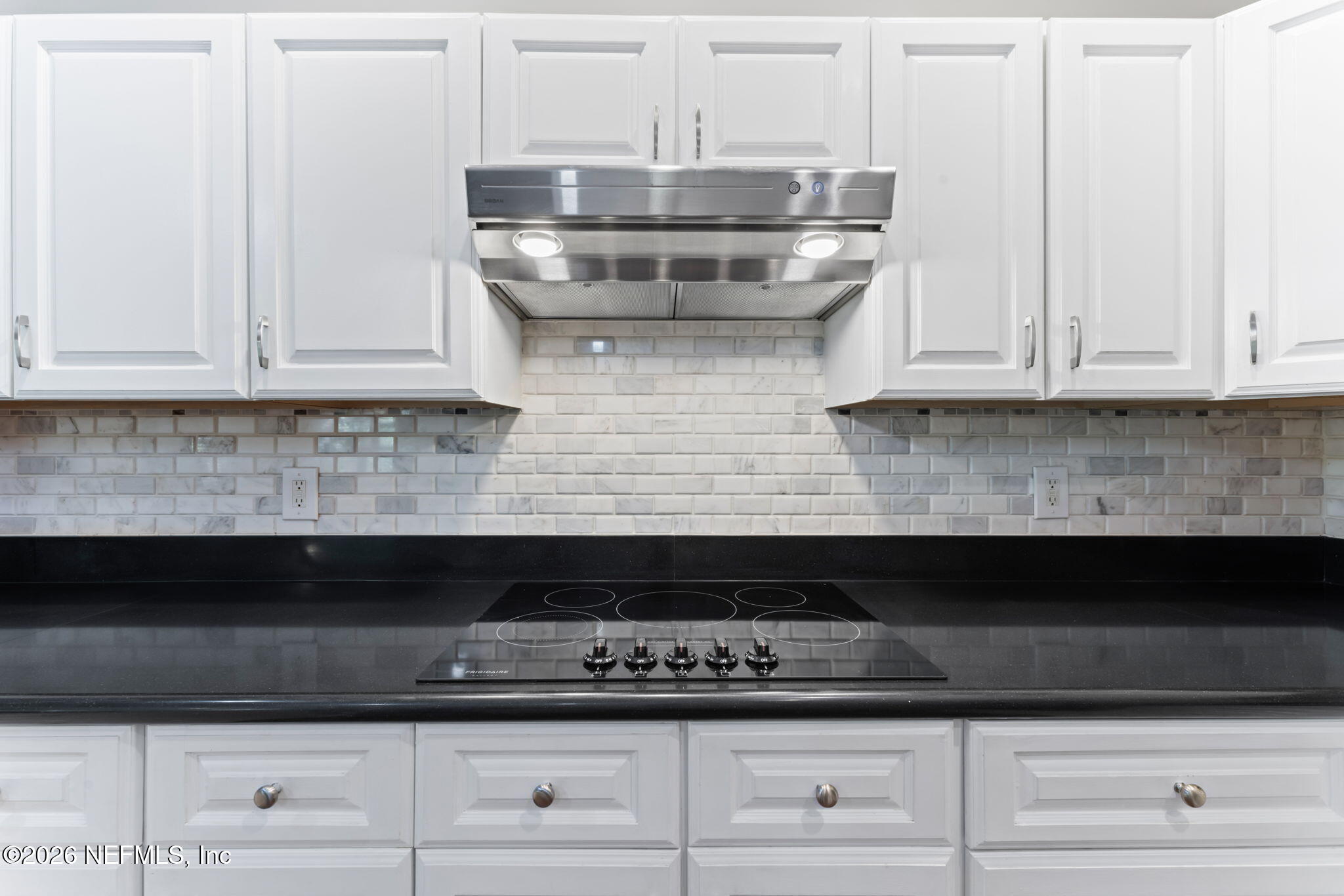 5663 Greenland Road, Unit 1201 Jacksonville, FL 32258 - Photo 13 of 82 a kitchen with stainless steel appliances granite countertop white cabinets and a stove