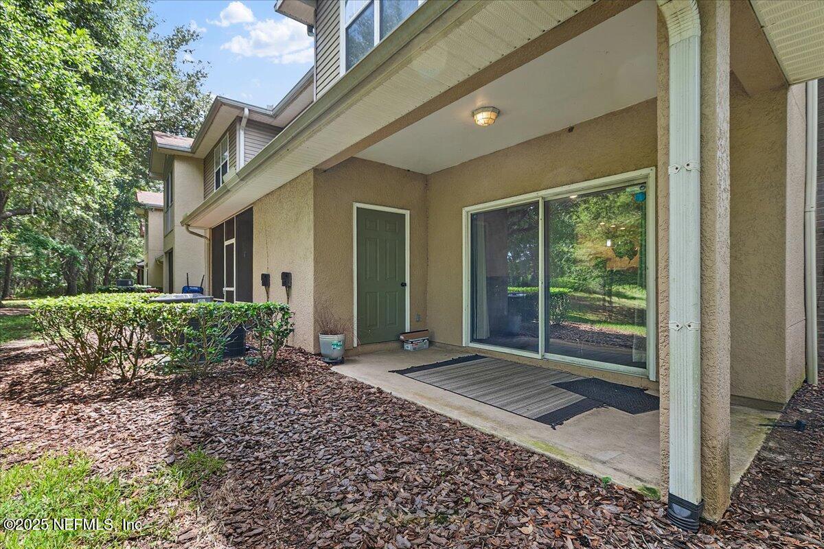5663 Greenland Road, Unit 1201 Jacksonville, FL 32258 - Photo 17 of 18 a front view of a house with a yard