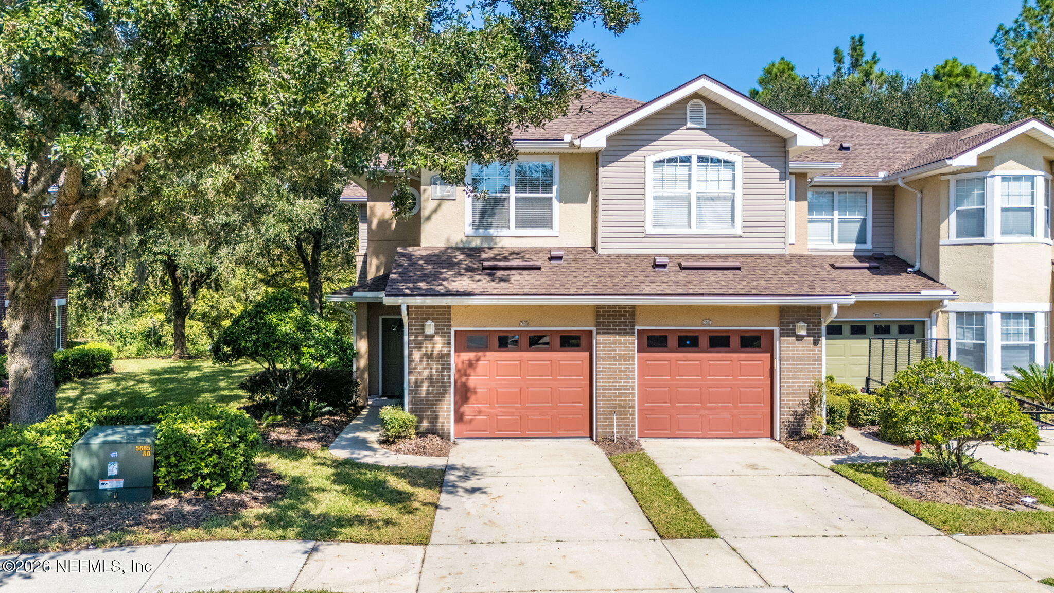 5663 Greenland Road, Unit 1201 Jacksonville, FL 32258 - Photo 2 of 82 a front view of a house with a garden