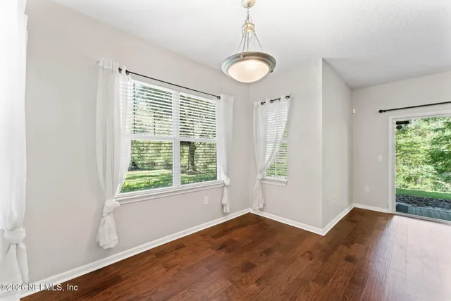 a view of room with a ceiling fan and window