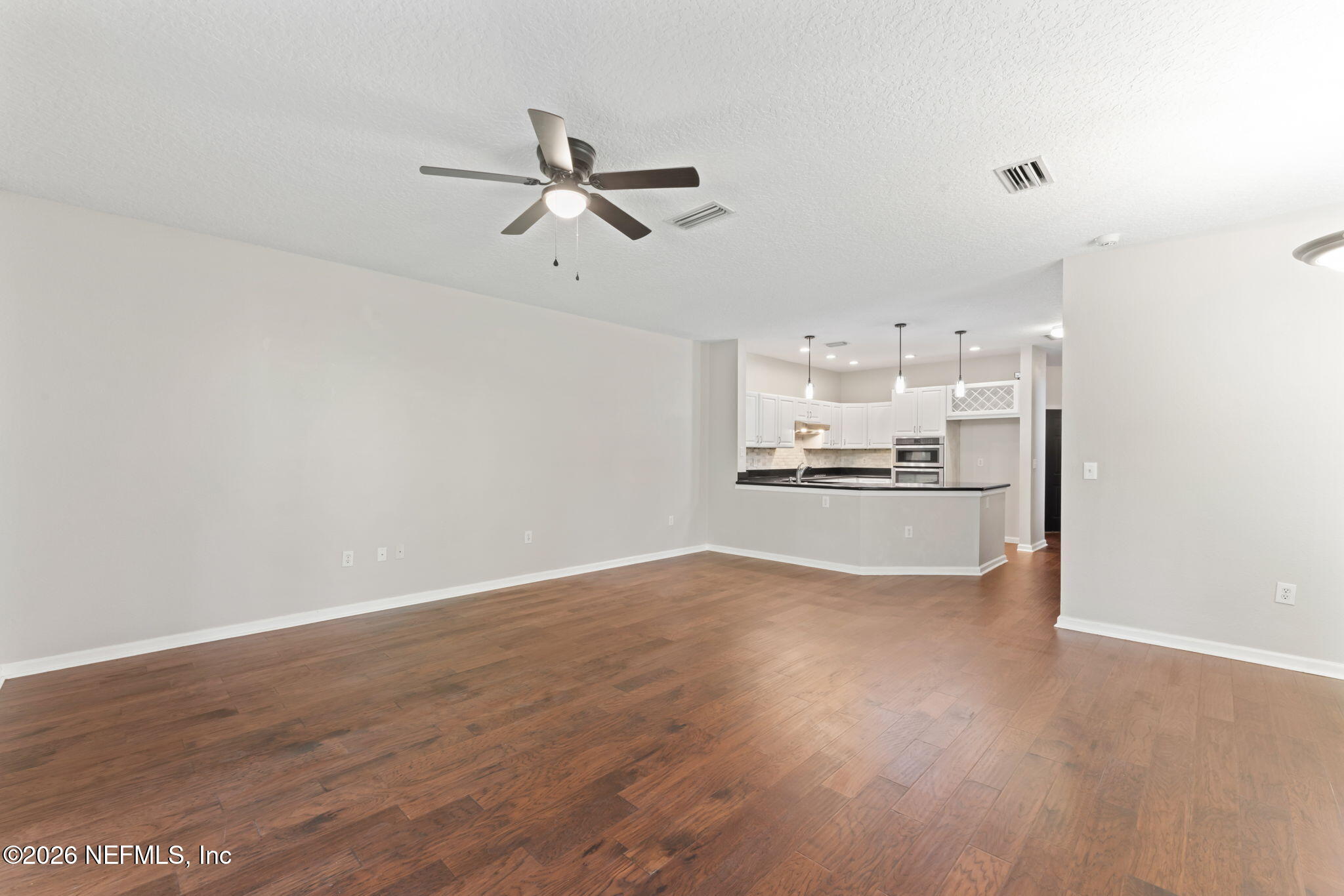 5663 Greenland Road, Unit 1201 Jacksonville, FL 32258 - Photo 25 of 82 a view of a kitchen with a sink and wooden floor