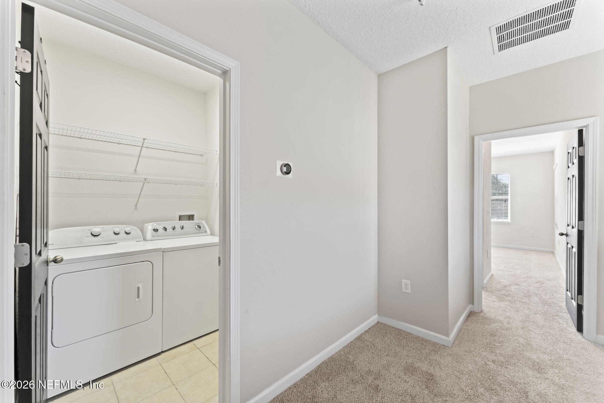 5663 Greenland Road, Unit 1201 Jacksonville, FL 32258 - Photo 27 of 82 a view of storage and utility room with washer and dryer