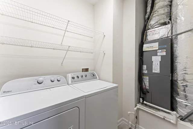 an empty room with a ceiling fan and a ceiling fan