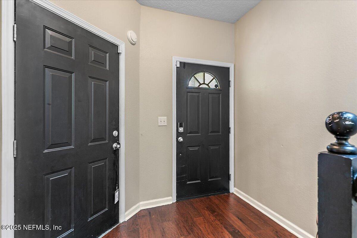5663 Greenland Road, Unit 1201 Jacksonville, FL 32258 - Photo 3 of 18 wooden floor in an empty room