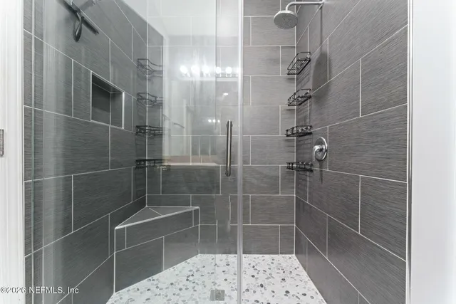 an aerial view of a house with a lake view