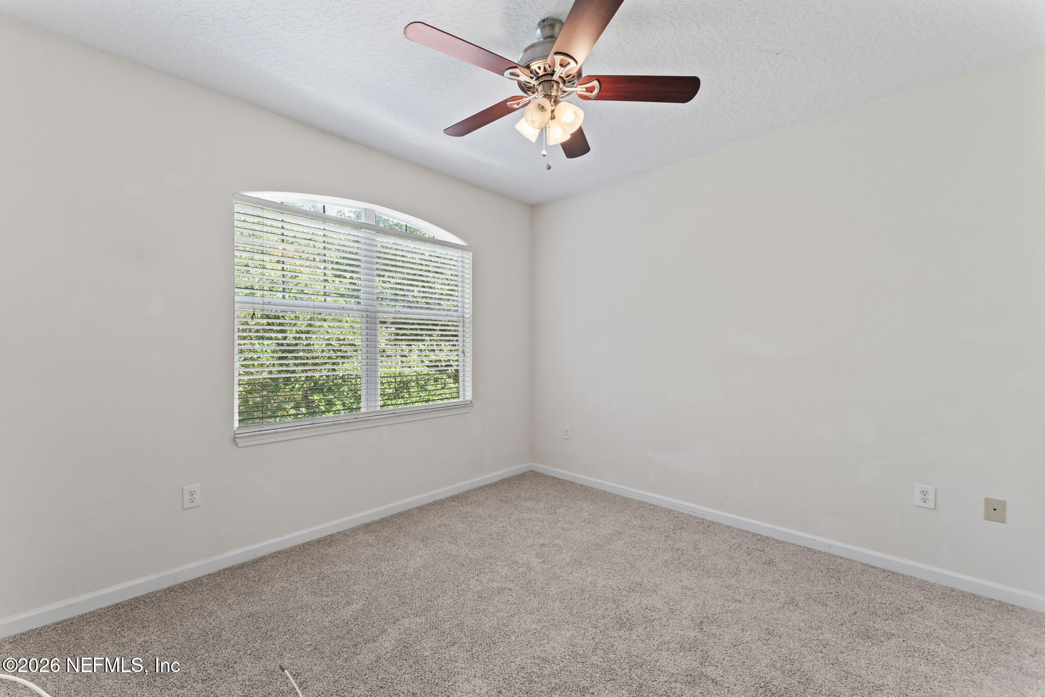 5663 Greenland Road, Unit 1201 Jacksonville, FL 32258 - Photo 39 of 82 an empty room with windows and fan