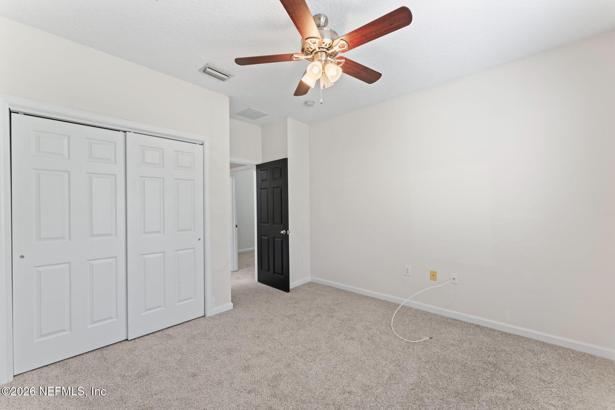5663 Greenland Road, Unit 1201 Jacksonville, FL 32258 - Photo 41 of 82 an empty room with a ceiling fan and a ceiling fan
