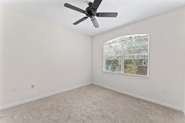 an aerial view of a house with outdoor space