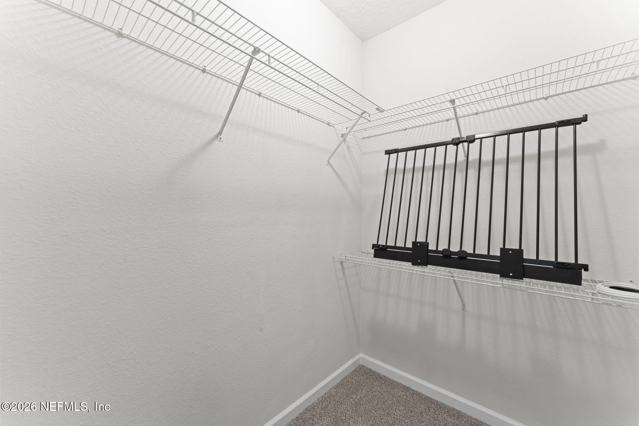 5663 Greenland Road, Unit 1201 Jacksonville, FL 32258 - Photo 46 of 82 a view of a wall with rack on the wall