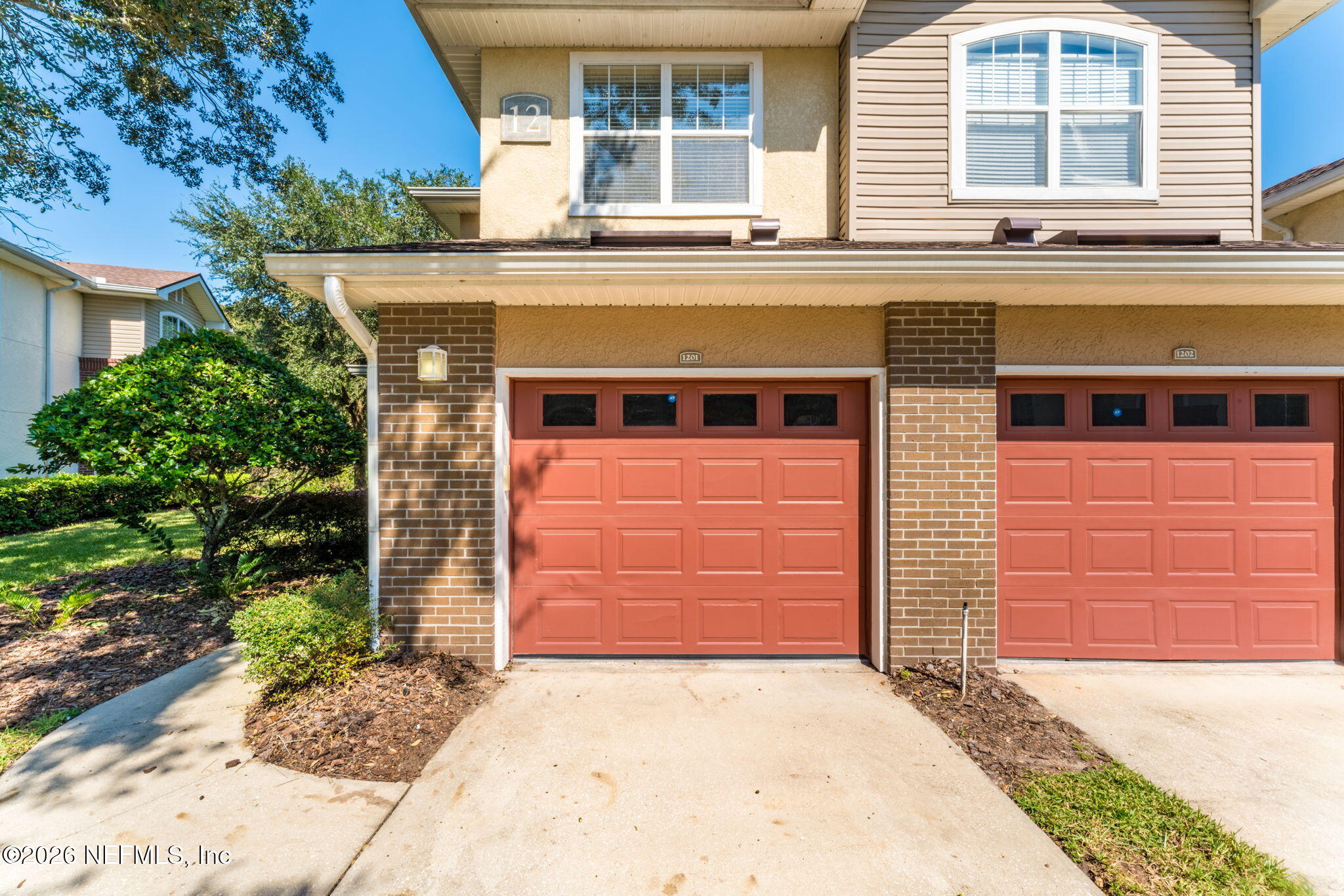 5663 Greenland Road, Unit 1201 Jacksonville, FL 32258 - Photo 59 of 82 a front view of a house with a garage
