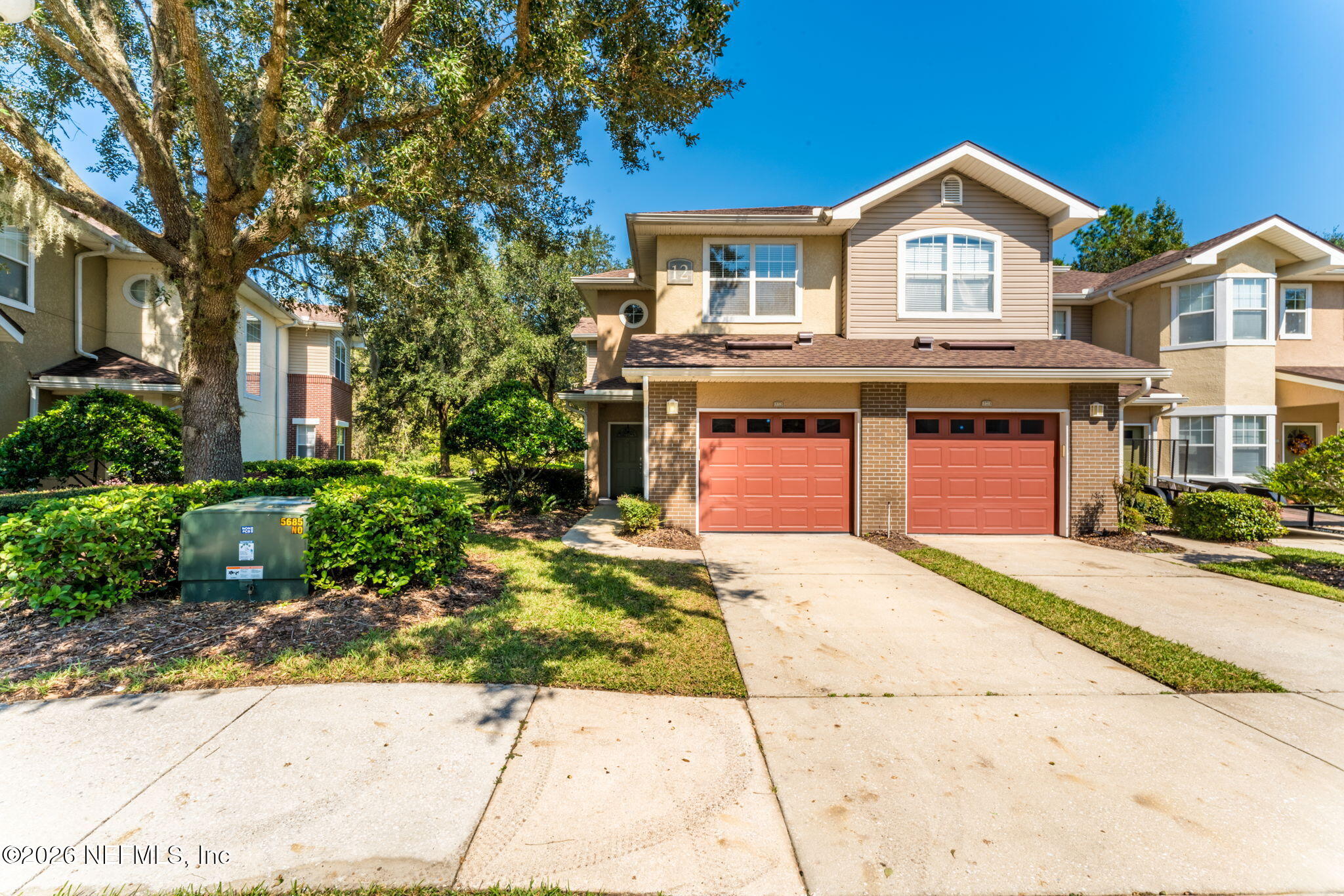 5663 Greenland Road, Unit 1201 Jacksonville, FL 32258 - Photo 60 of 82 a front view of a house with a garden