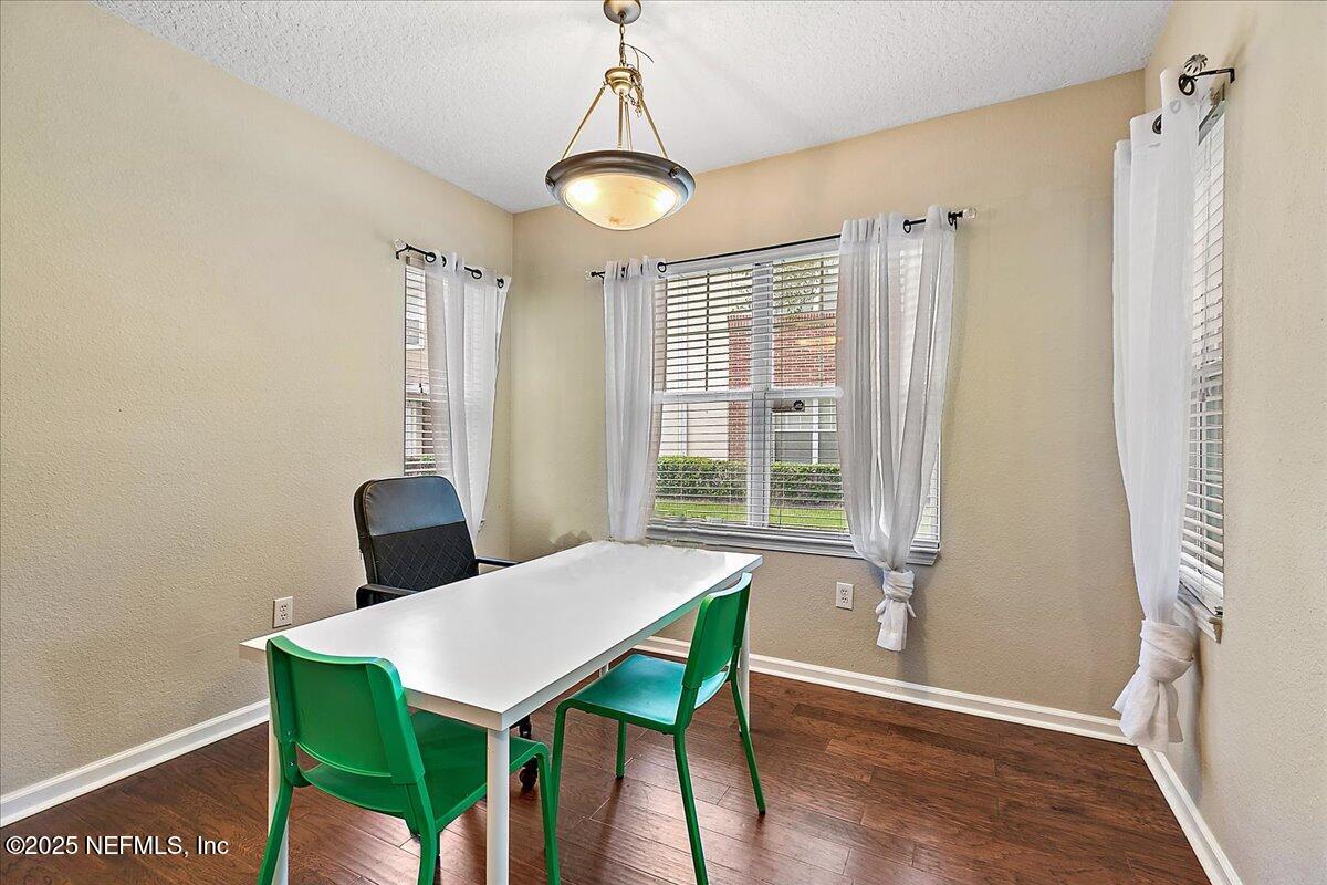 5663 Greenland Road, Unit 1201 Jacksonville, FL 32258 - Photo 6 of 18 a view of a dining room with furniture window and wooden floor