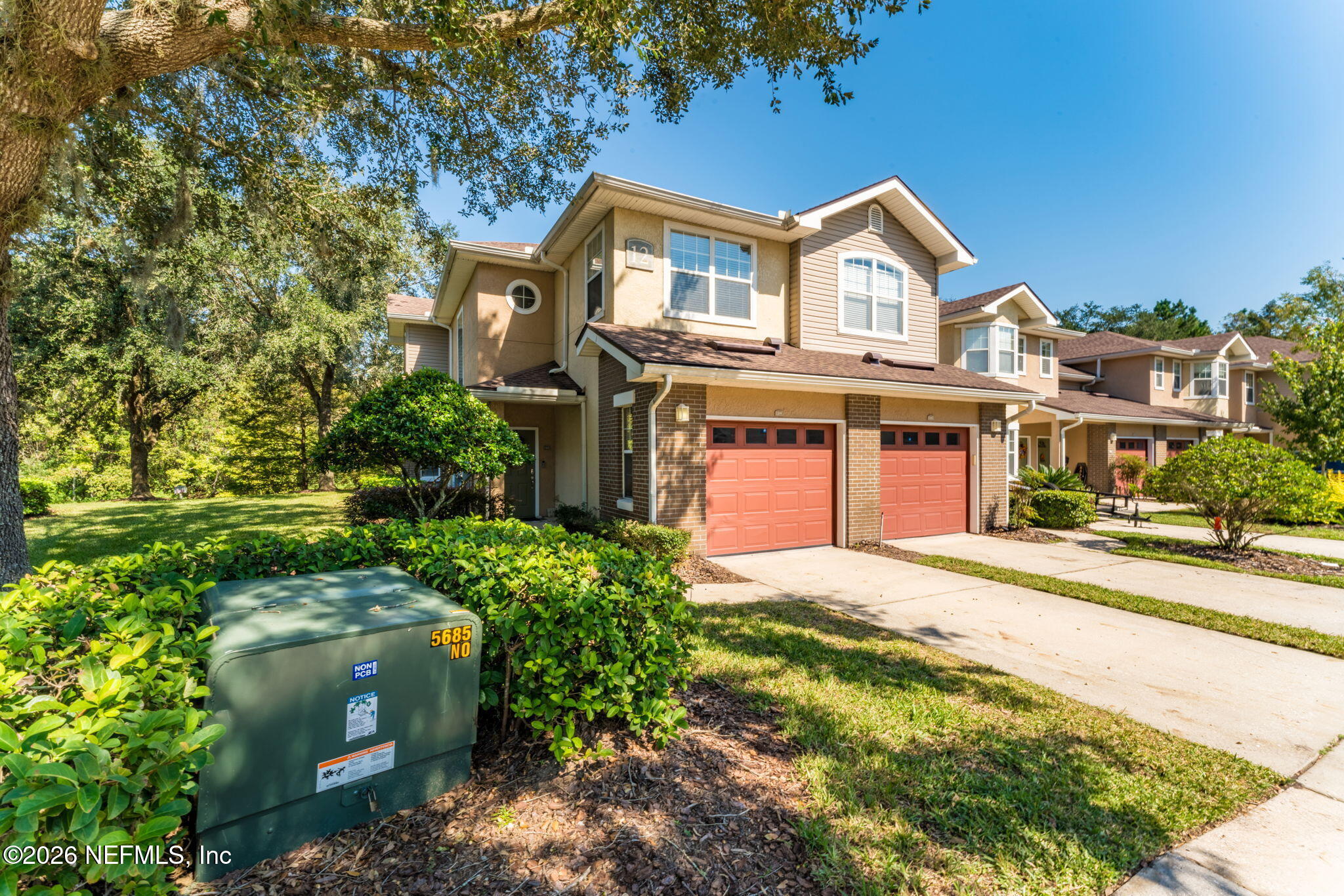 5663 Greenland Road, Unit 1201 Jacksonville, FL 32258 - Photo 61 of 82 front view of a house with a garden
