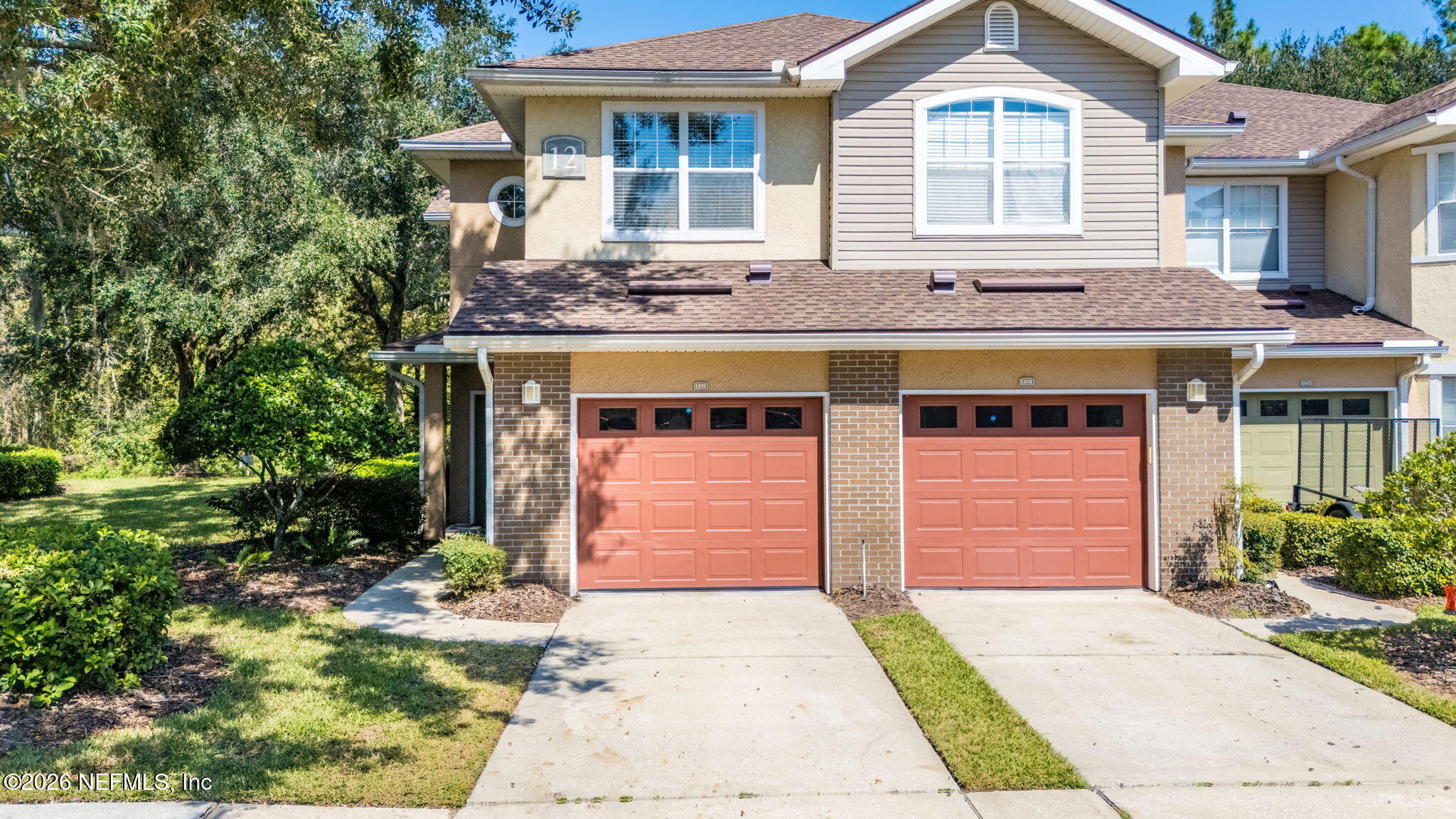 5663 Greenland Road, Unit 1201 Jacksonville, FL 32258 - Photo 62 of 82 a front view of a house with a garden